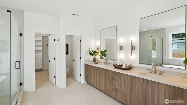 1118 N 34th St, Renton, WA 98056 - bathroom featuring double vanity, a shower stall, a closet, a bathtub, and tile patterned flooring