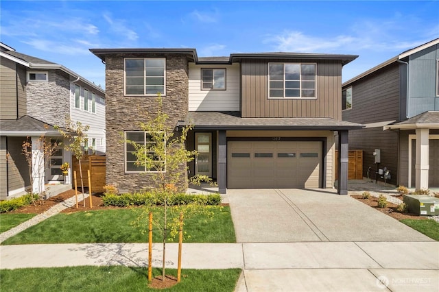 20851 156th St E, Bonney Lake, WA 98391 - view of front facade with stone siding, concrete driveway, and a garage