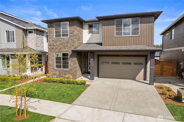 20851 156th St E, Bonney Lake, WA 98391 - view of front of home featuring stone siding, driveway, and an attached garage