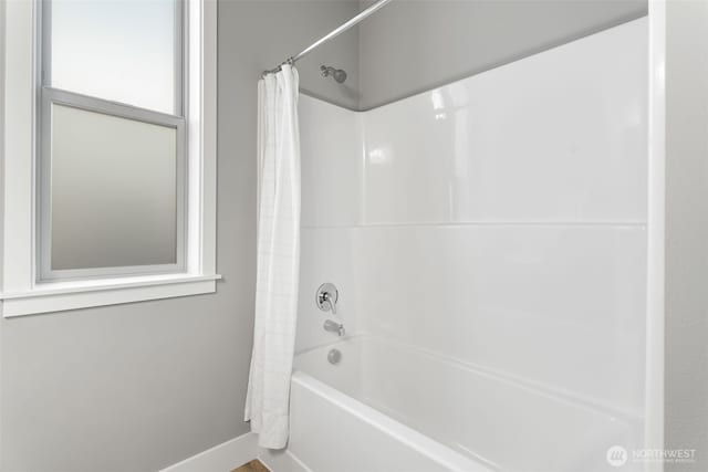 20851 156th St E, Bonney Lake, WA 98391 - full bathroom featuring shower / bathtub combination with curtain and baseboards