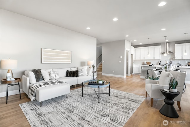 20851 156th St E, Bonney Lake, WA 98391 - living room featuring light wood-type flooring, recessed lighting, and stairs