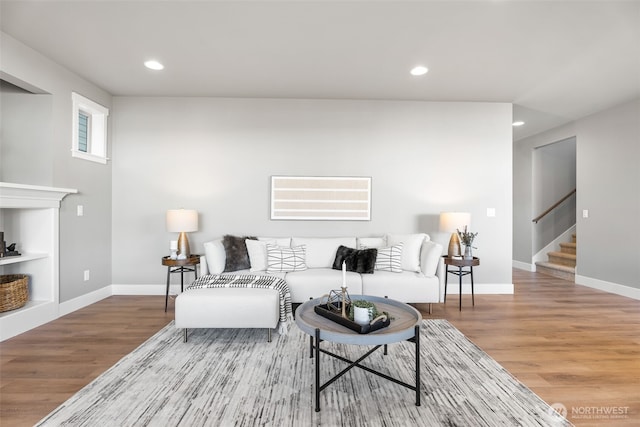 20851 156th St E, Bonney Lake, WA 98391 - living area featuring wood finished floors, stairway, and recessed lighting