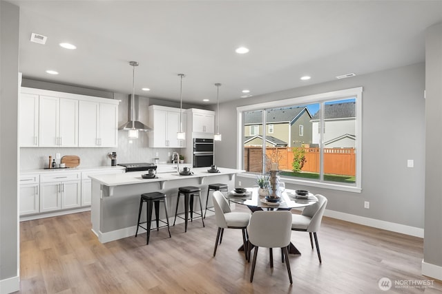 20851 156th St E, Bonney Lake, WA 98391 - dining area featuring recessed lighting and light wood-style floors