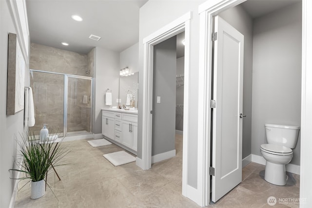 20851 156th St E, Bonney Lake, WA 98391 - bathroom with vanity, a stall shower, a spacious closet, recessed lighting, and tile patterned flooring