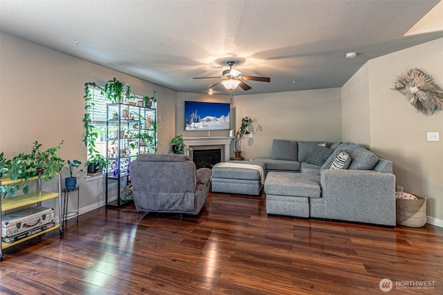 5003 Madison Heights Ct SE, Olympia, WA 98501 - living room featuring a ceiling fan, wood finished floors, and a glass covered fireplace