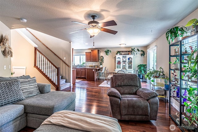 5003 Madison Heights Ct SE, Olympia, WA 98501 - living area featuring dark wood-style floors, ceiling fan, a textured ceiling, and stairway