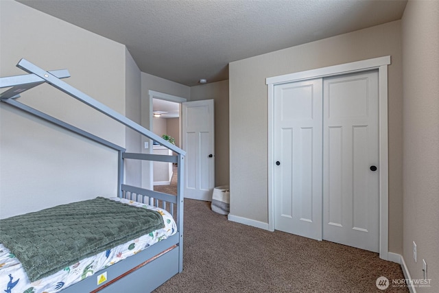 5003 Madison Heights Ct SE, Olympia, WA 98501 - bedroom featuring carpet floors, a closet, and a textured ceiling