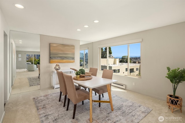 1234 Taylor Ave N Unit 401, Seattle, WA 98109 - dining area featuring light carpet, a baseboard radiator, plenty of natural light, and recessed lighting