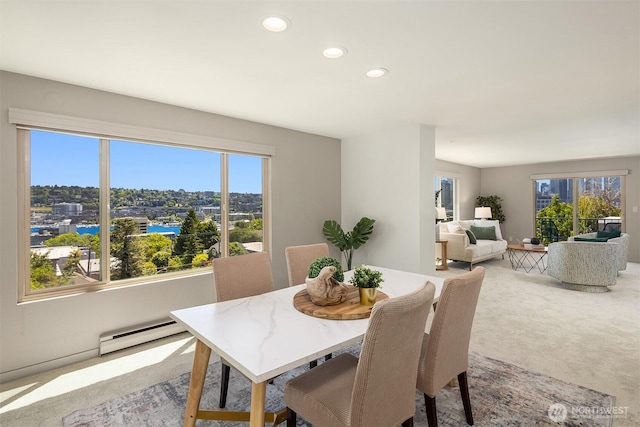 1234 Taylor Ave N Unit 401, Seattle, WA 98109 - dining room featuring a baseboard radiator, recessed lighting, healthy amount of natural light, and carpet flooring