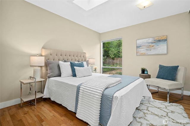 16654 SE 26th Pl, Bellevue, WA 98008 - bedroom featuring a skylight and wood finished floors