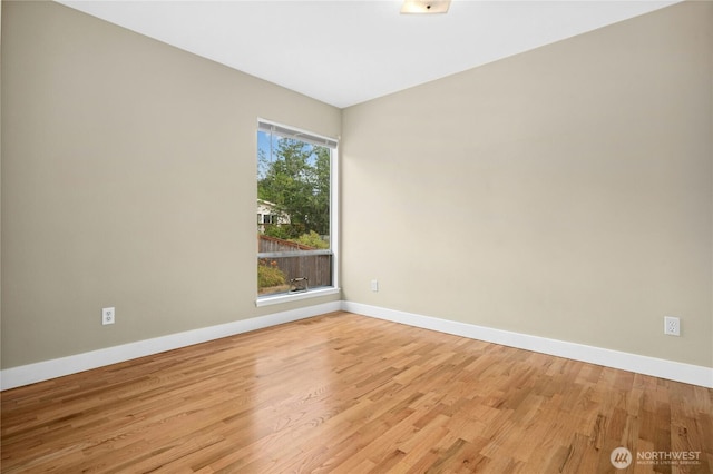 16654 SE 26th Pl, Bellevue, WA 98008 - empty room with light wood-style flooring and baseboards