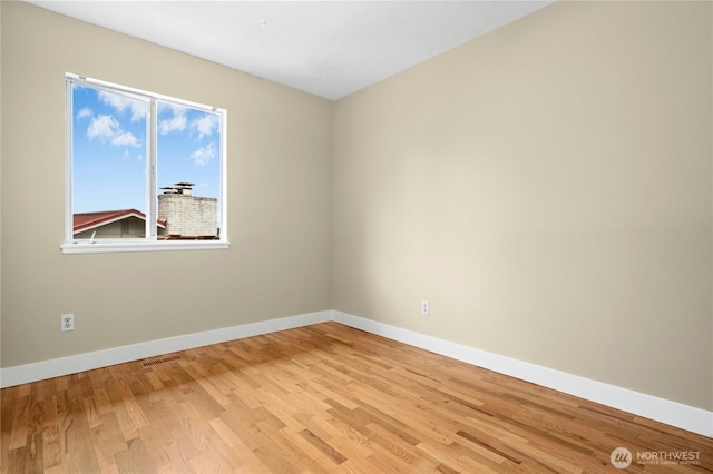 16654 SE 26th Pl, Bellevue, WA 98008 - empty room featuring baseboards and light wood-style flooring