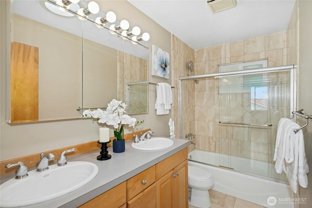 16654 SE 26th Pl, Bellevue, WA 98008 - full bathroom featuring bath / shower combo with glass door, double vanity, and tile patterned flooring