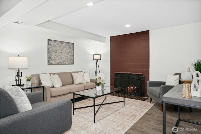 16654 SE 26th Pl, Bellevue, WA 98008 - living area featuring wood finished floors, a large fireplace, and recessed lighting