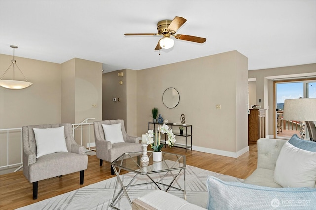 16654 SE 26th Pl, Bellevue, WA 98008 - living room featuring ceiling fan and wood finished floors