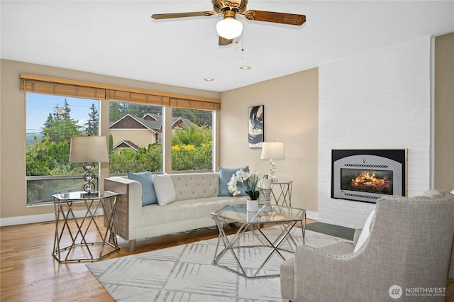 16654 SE 26th Pl, Bellevue, WA 98008 - living room featuring wood finished floors, ceiling fan, a fireplace, and recessed lighting