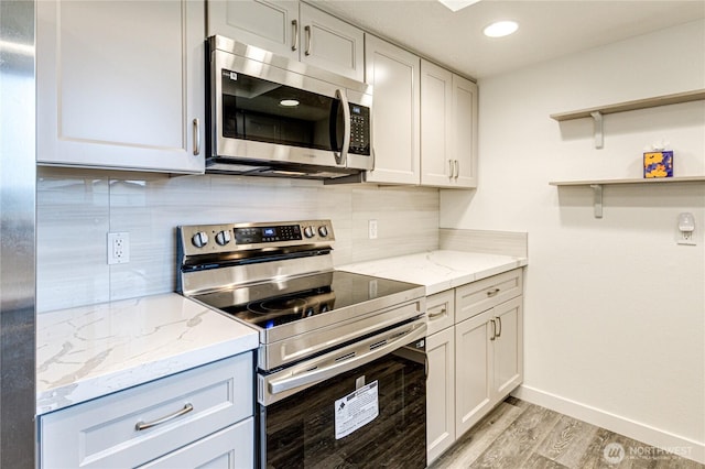 60 Crystal Ct, Sequim, WA 98382 - kitchen featuring stainless steel appliances, light wood finished floors, decorative backsplash, light stone counters, and recessed lighting