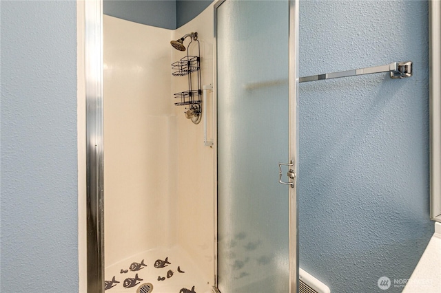 60 Crystal Ct, Sequim, WA 98382 - bathroom with a stall shower and a textured wall