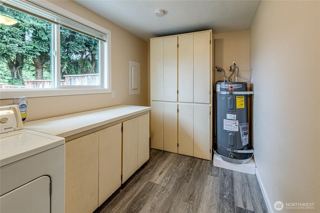 60 Crystal Ct, Sequim, WA 98382 - washroom with water heater, washer / clothes dryer, cabinet space, wood finished floors, and healthy amount of natural light