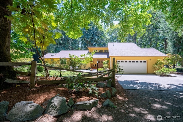 2327 31st Ave NW, Olympia, WA 98502 - mid-century inspired home with an attached garage and concrete driveway