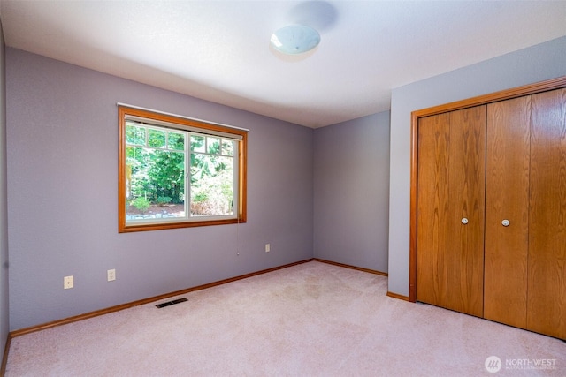 2327 31st Ave NW, Olympia, WA 98502 - unfurnished bedroom featuring carpet flooring and a closet