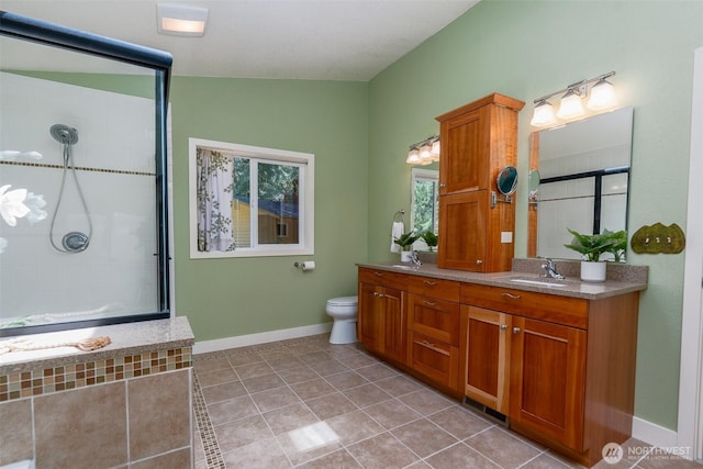 2327 31st Ave NW, Olympia, WA 98502 - bathroom featuring double vanity, a tile shower, and tile patterned flooring