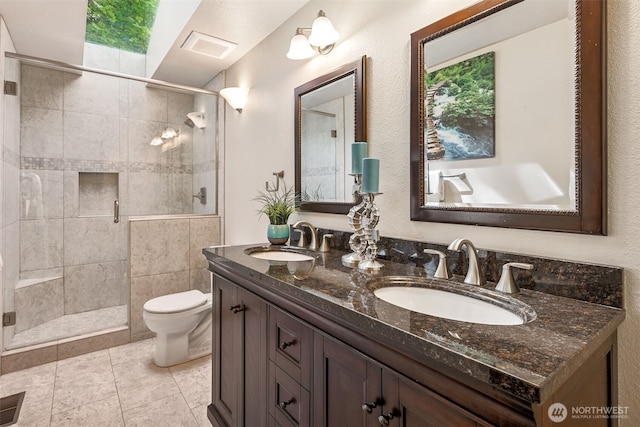 5415 Johnson Point Rd NE, Olympia, WA 98516 - full bathroom featuring double vanity, a shower stall, and tile patterned flooring