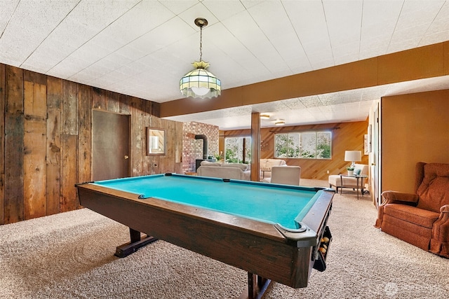 5415 Johnson Point Rd NE, Olympia, WA 98516 - playroom with wood walls, carpet flooring, a wood stove, and pool table