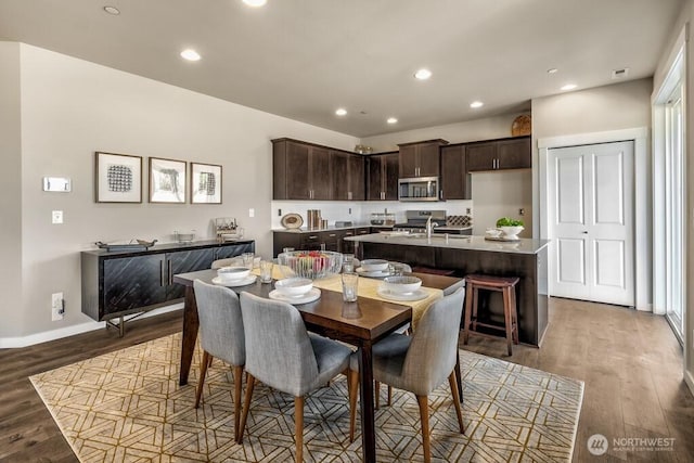 28003 74th Ave NW Unit 33, Stanwood, WA 98292 - dining area featuring wood finished floors and recessed lighting