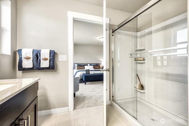 28003 74th Ave NW Unit 33, Stanwood, WA 98292 - ensuite bathroom featuring a shower stall, vanity, and tile patterned flooring