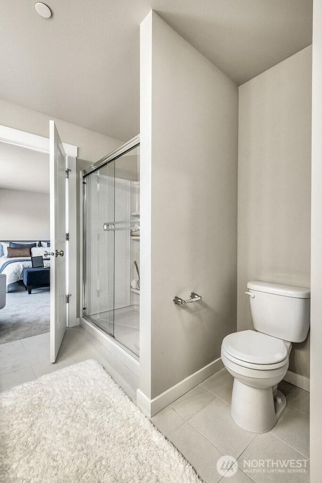 28003 74th Ave NW Unit 33, Stanwood, WA 98292 - bathroom featuring tile patterned floors, a stall shower, and ensuite bathroom