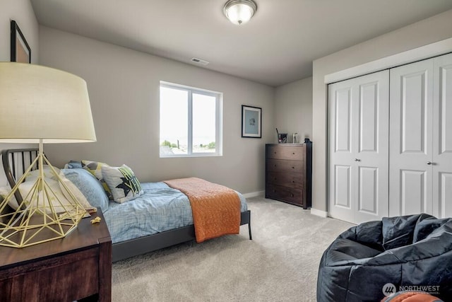 28003 74th Ave NW Unit 33, Stanwood, WA 98292 - bedroom with light colored carpet and a closet