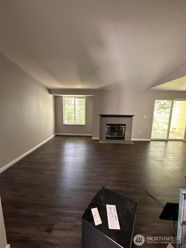 11002 SE Petrovitsky Rd Unit F302, Renton, WA 98055 - unfurnished living room with a high end fireplace and dark wood-style flooring