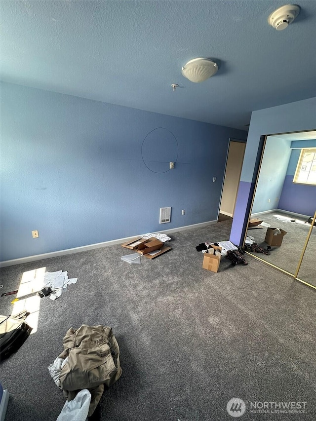 11002 SE Petrovitsky Rd Unit F302, Renton, WA 98055 - unfurnished bedroom featuring a textured ceiling and carpet floors