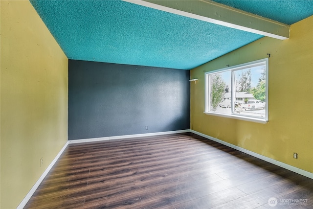 11846 SE 170th Pl, Renton, WA 98258 - spare room featuring wood finished floors, a textured ceiling, and vaulted ceiling