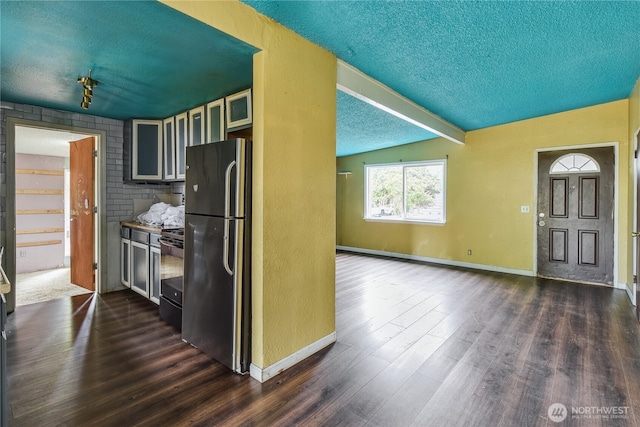 11846 SE 170th Pl, Renton, WA 98258 - kitchen featuring freestanding refrigerator, a textured ceiling, electric range, dark wood finished floors, and glass insert cabinets