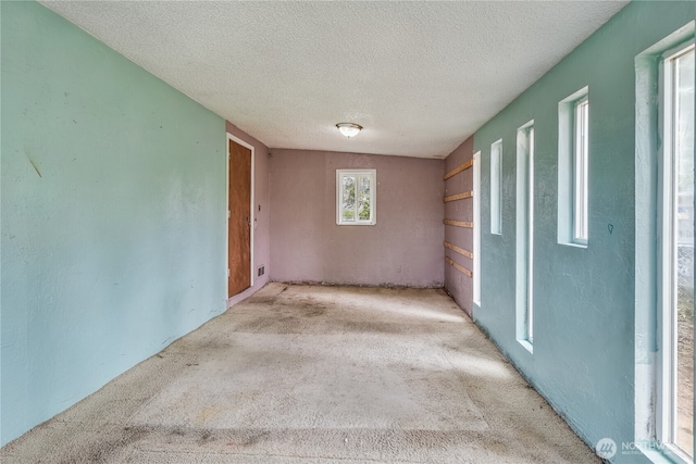 11846 SE 170th Pl, Renton, WA 98258 - carpeted spare room featuring a textured ceiling