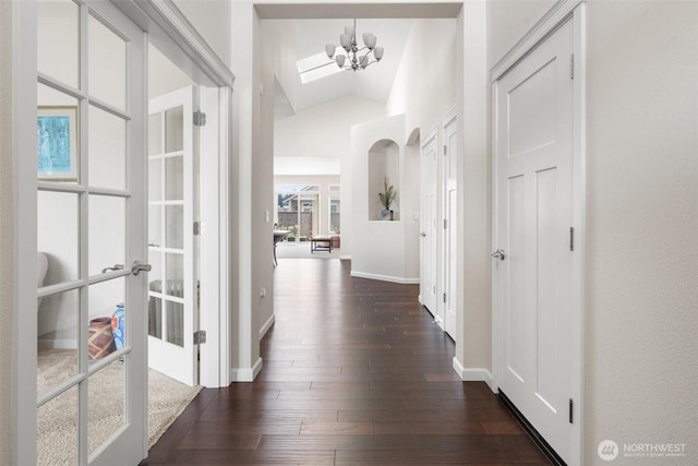 9647 6th Way SE, Lacey, WA 98513 - corridor with vaulted ceiling, dark wood finished floors, a chandelier, and a skylight