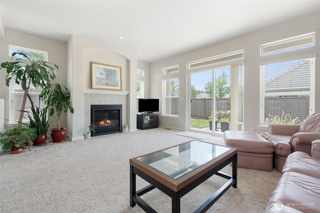 9647 6th Way SE, Lacey, WA 98513 - carpeted living area with healthy amount of natural light and a tiled fireplace
