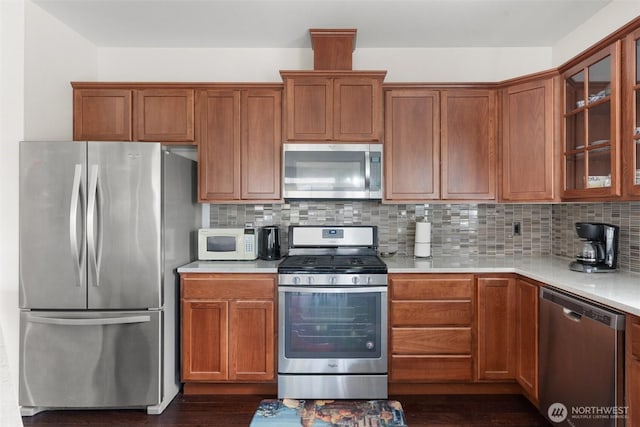 9647 6th Way SE, Lacey, WA 98513 - kitchen with appliances with stainless steel finishes, light countertops, glass insert cabinets, and decorative backsplash