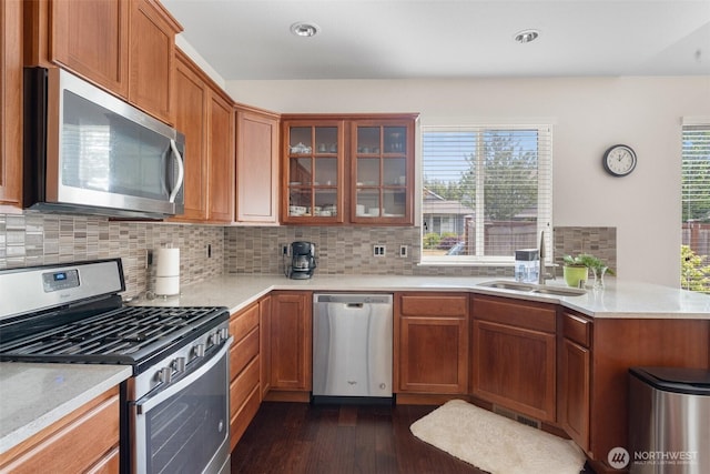 9647 6th Way SE, Lacey, WA 98513 - kitchen with appliances with stainless steel finishes, dark wood finished floors, glass insert cabinets, decorative backsplash, and light countertops