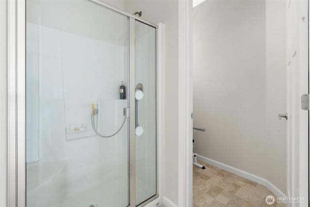 9647 6th Way SE, Lacey, WA 98513 - bathroom featuring a stall shower and baseboards