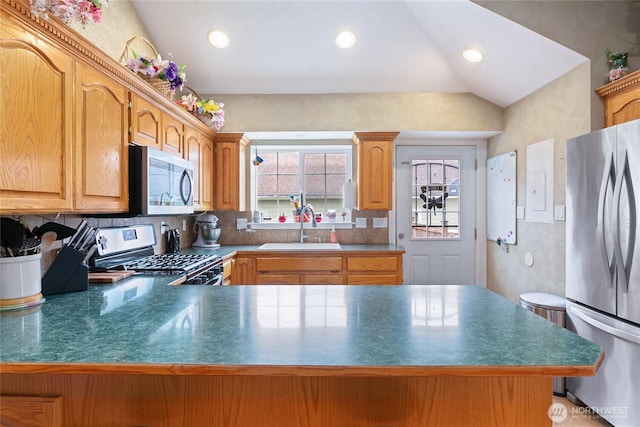 302 S Washington, Everson, WA 98247 - kitchen featuring appliances with stainless steel finishes, plenty of natural light, a peninsula, dark countertops, and recessed lighting