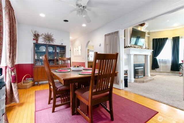 302 S Washington, Everson, WA 98247 - dining room featuring arched walkways, a ceiling fan, wood-type flooring, a fireplace, and recessed lighting