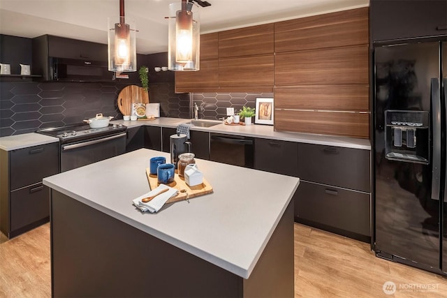 505 Belmont Ave E Unit 801, Seattle, WA 98102 - kitchen featuring black appliances, modern cabinets, light countertops, and light wood-type flooring