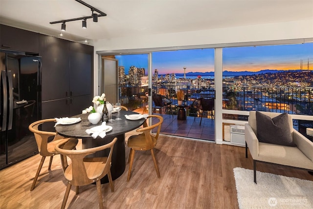 505 Belmont Ave E Unit 801, Seattle, WA 98102 - dining area with wood finished floors and track lighting