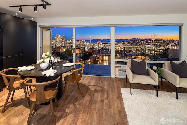 505 Belmont Ave E Unit 801, Seattle, WA 98102 - dining space featuring wood finished floors and track lighting