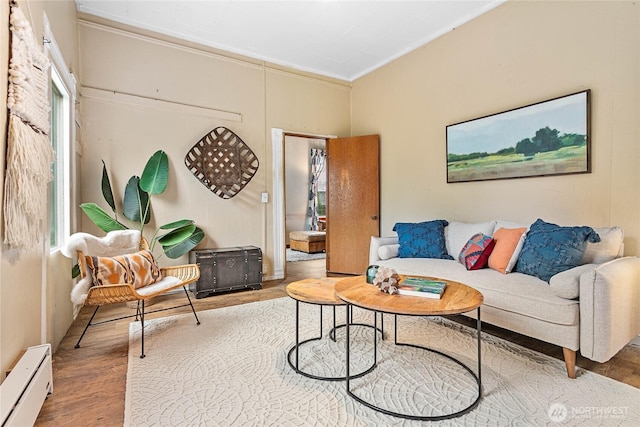 1814 Wilson Ave, Bellingham, WA 98225 - living room with baseboard heating, wood finished floors, and crown molding