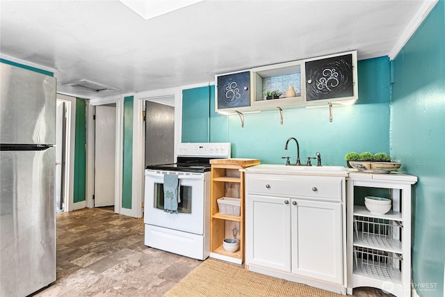 1814 Wilson Ave, Bellingham, WA 98225 - kitchen with white electric range, freestanding refrigerator, open shelves, white cabinetry, and stone finish floors