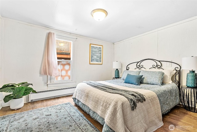 1814 Wilson Ave, Bellingham, WA 98225 - bedroom with baseboard heating and wood finished floors